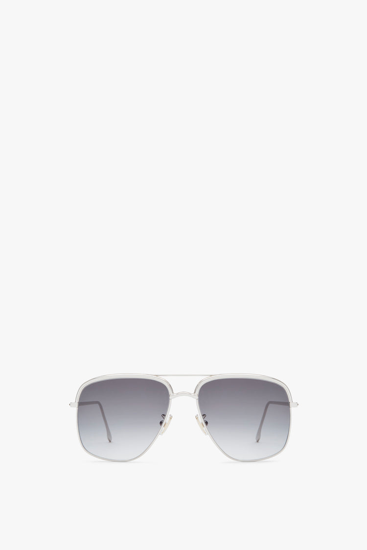 A pair of Double Brow Navigator in Silver with gradient Zeiss lenses and a metal frame by Victoria Beckham, handcrafted in Italy, shown on a white background.